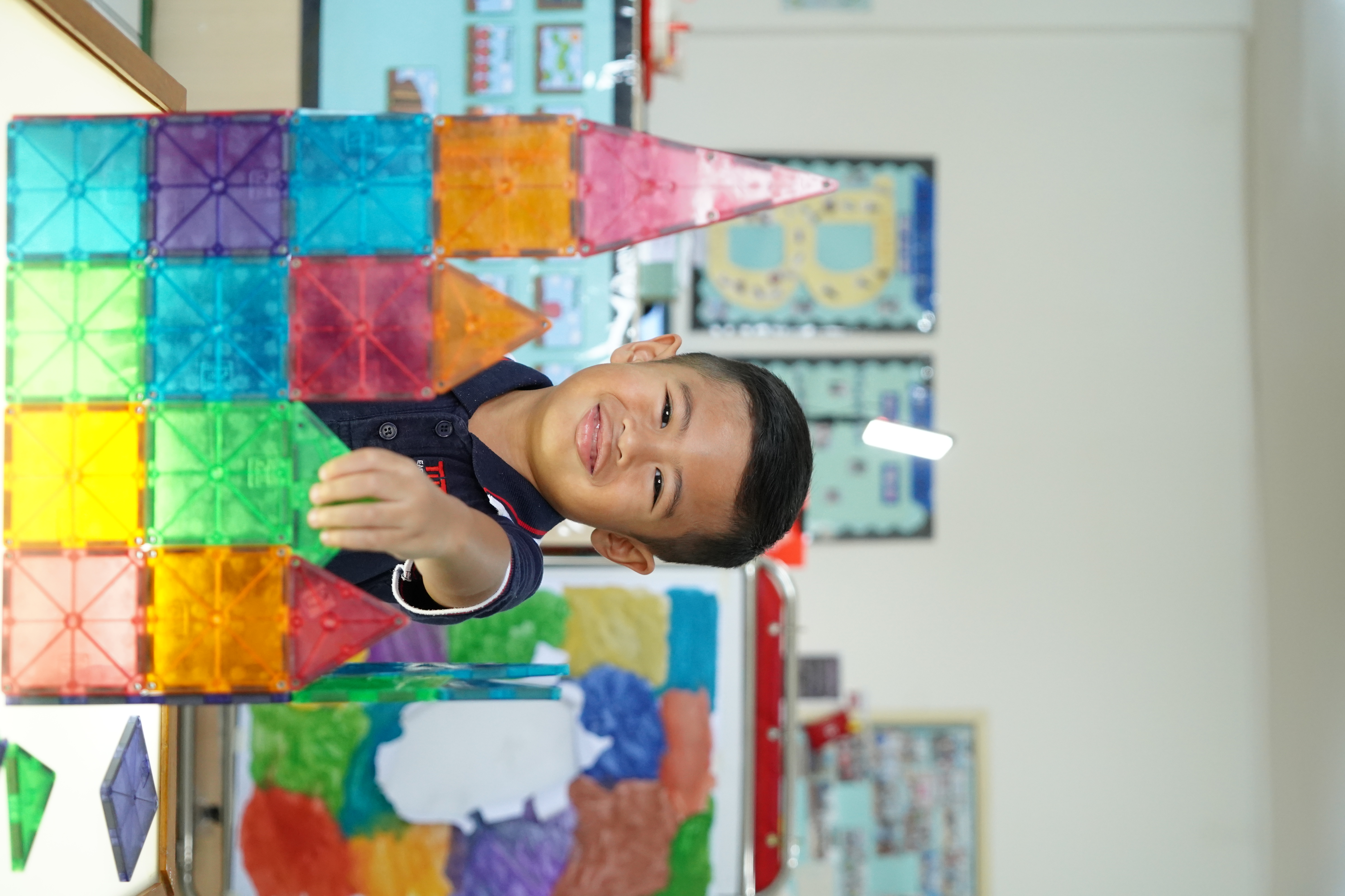 Tutor Time student engaged in hands-on learning activity